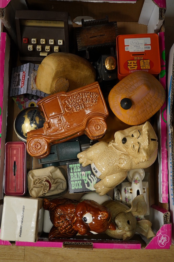 A large quantity (in three boxes) of novelty, advertising and general money boxes mostly from the mid to late 20th century, tallest a clown Ellgreave money box 27cm high. Condition - varied from poor to good